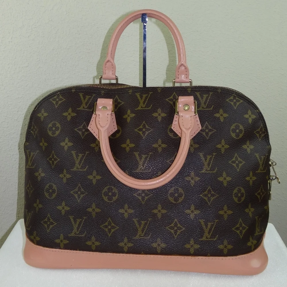 Louis Vuitton Brown Monogram Satchel with Pink Trim and Red Pom-Pom Charm
